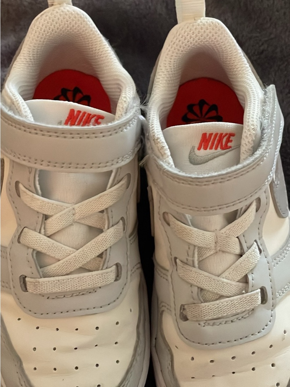 Nike White Kids Sneakers with vibrant orange Accents